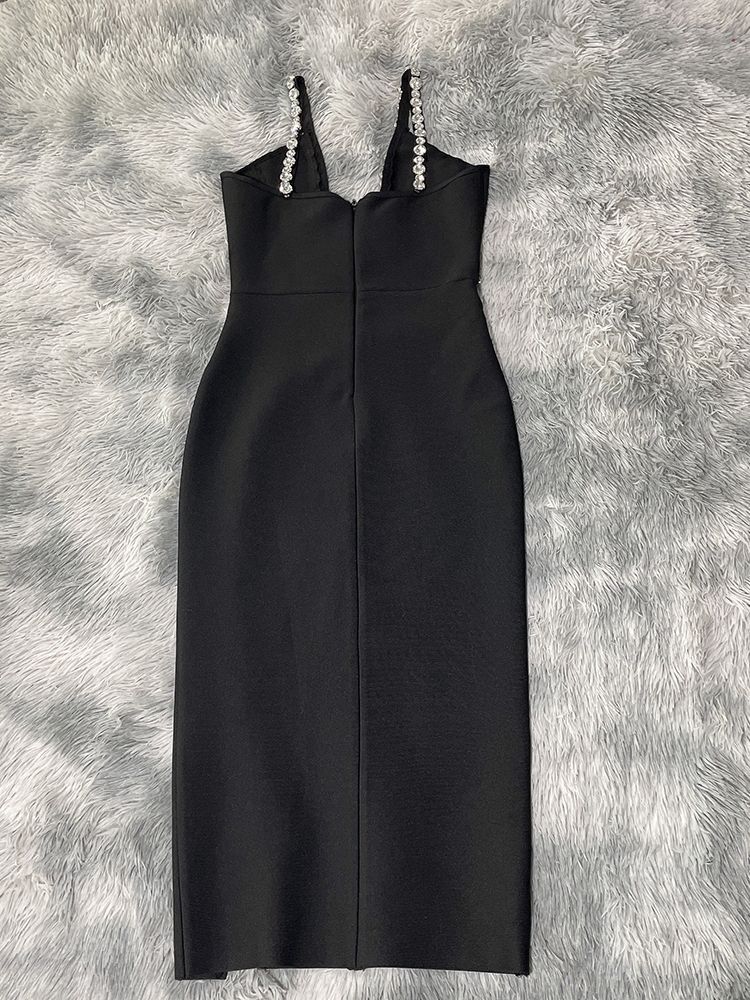 Black halter dress with zipper front and diamond accents, featuring a backless design and tight fit.